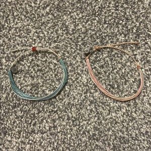 two adjustable multicolored bracelets